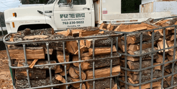 Stacked bagged firewood delivered by McKay Tree Service in Cornelia, GA, seasoned hardwood ready to burn for fireplaces and outdoor use.